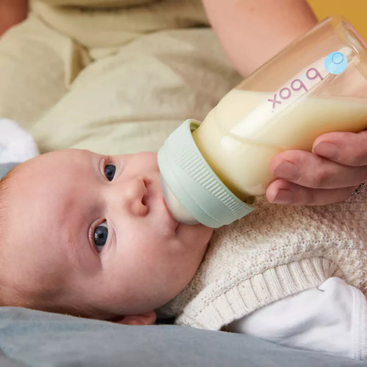 Infant drinking milk from B.Box