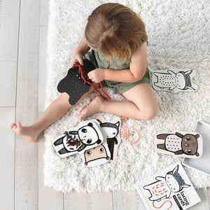 Child playing lacing cards - Baby Animals