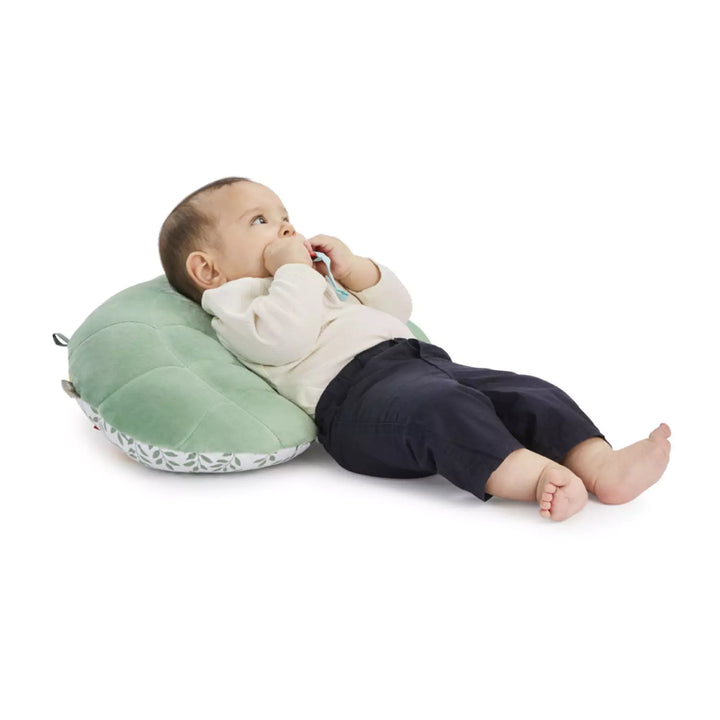 Baby with tummy time pillow