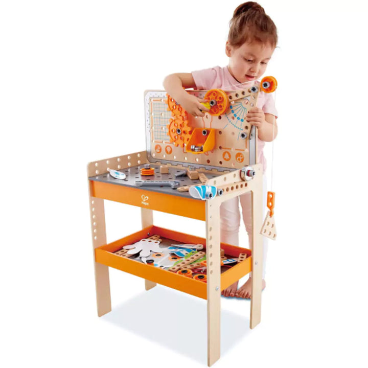 Child Playing with Science wooden work bench 