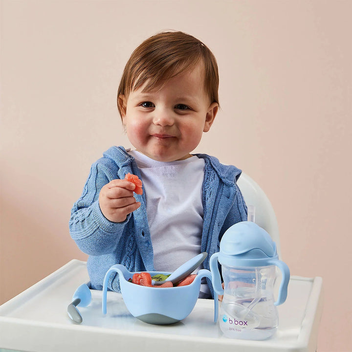 Baby happily drinking from the B.box Sippy Cup (Bubblegum)