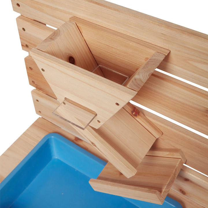 Close-up of the mud kitchen's sink, sandpit, and realistic details