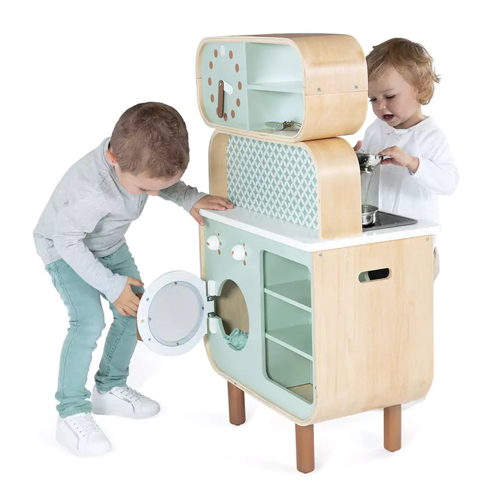 They are playing with Janod wooden kitchen