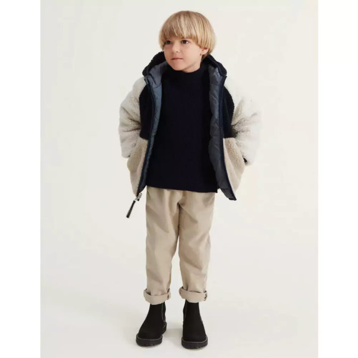 Child wearing Liewood jacket