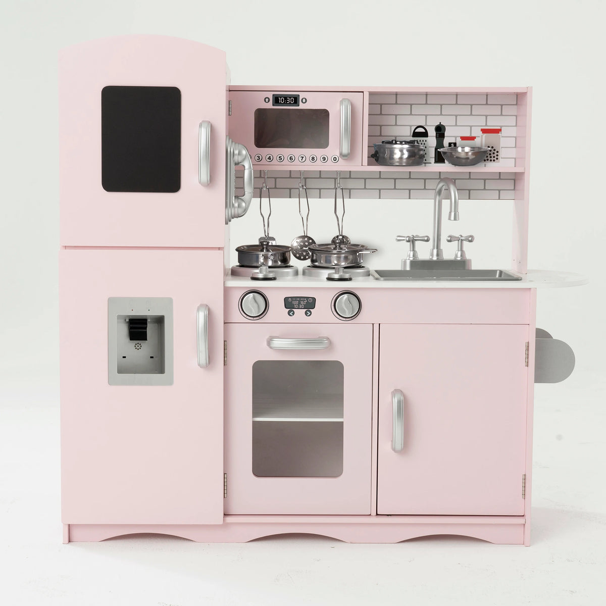 A pink wooden toy kitchen set with a refrigerator, stove, sink, shelves, and small accessories, photographed against a plain white studio background.