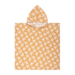 The Kids Beach Poncho laid out flat, showing that it is 65 cm by 65 cm and showing the pattern as a whole.