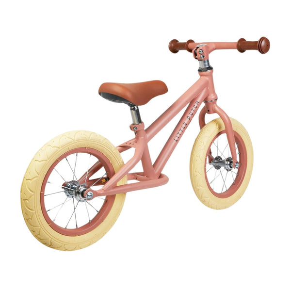Adorable Little Dutch Balance Bike in Matt Pink: Perfect for toddlers learning to ride.