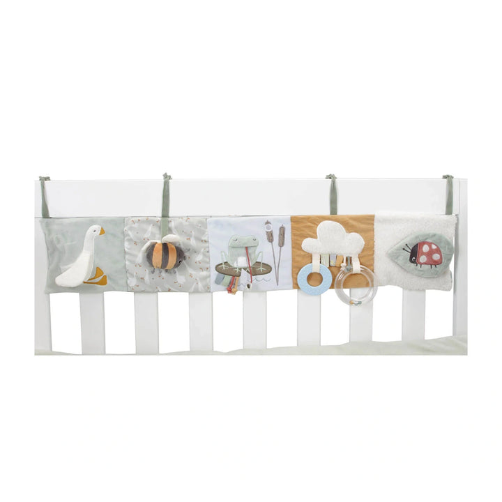 Easily attachable to a playpen or cot for convenient playtime engagement.