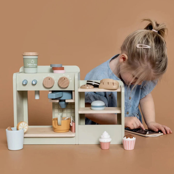 An adorable coffee and tea maker with realistic buttons and knobs, fostering hands-on play and sensory exploration