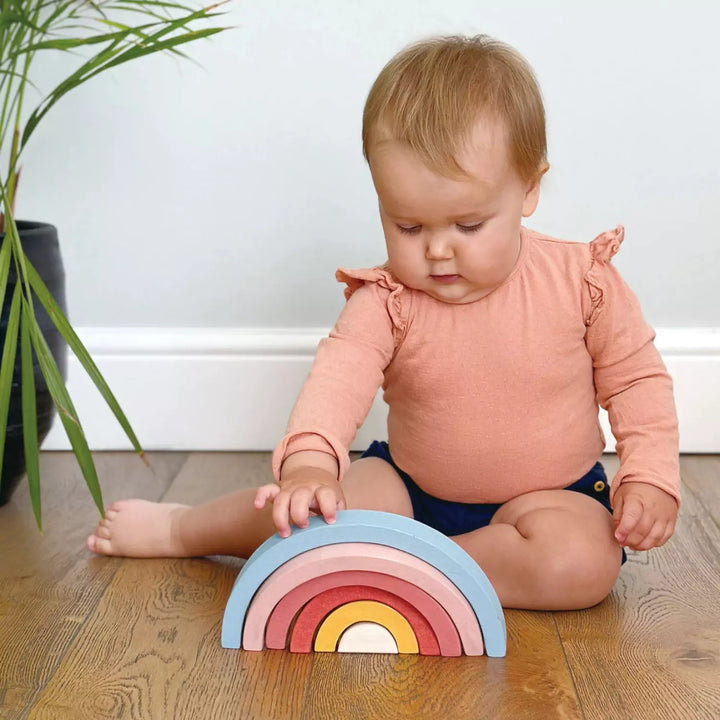 Child playing with stacking toys