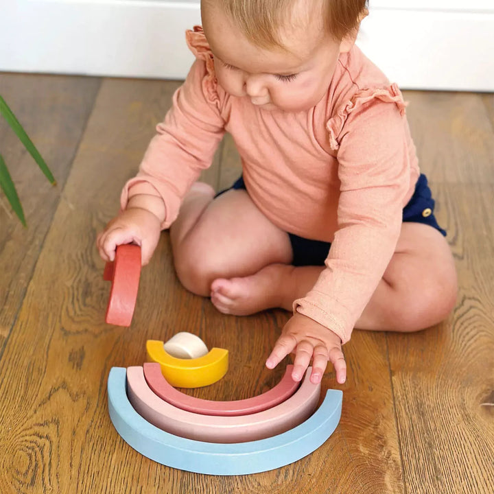 Child playing with stacking toys