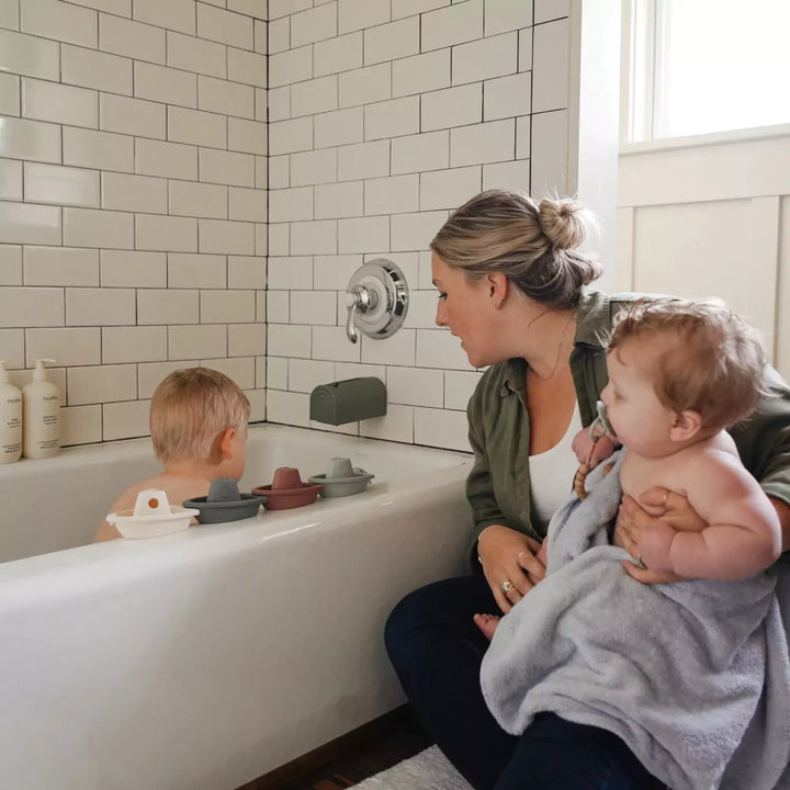 Mum with babies at bathtime