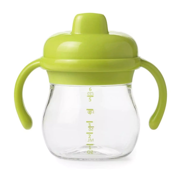 "OXO Green Sippy Cup with Leakproof Valve - Smooth sipping for toddlers, featuring a patented twist-in valve and removable handles for easy gripping.