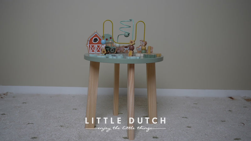 Video of the little dutch activity table - child exploring different activities on table
