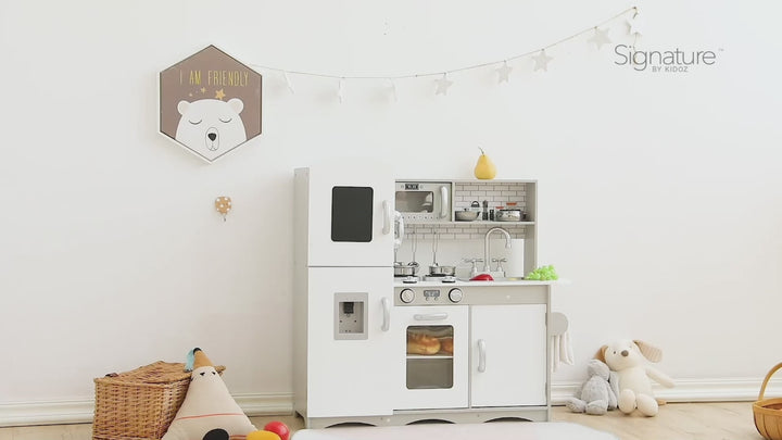 Video demonstrating the Signature Deluxe Grey Wooden Toy Kitchen Set. Close-ups of the realistic oven, microwave, working sink, and sound-and-light ice maker. A child happily pretends to cook and serve food, highlighting imaginative play.