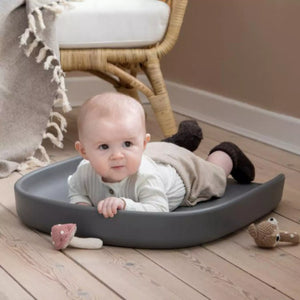Baby lying on a changing mat