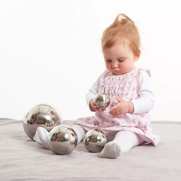 Baby playing with sensory balls