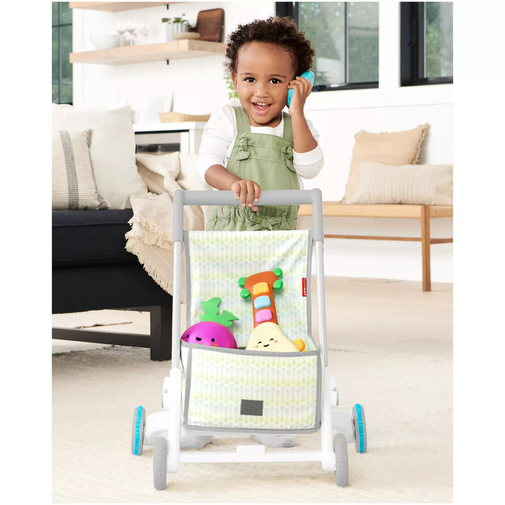 Child playing with a grow along activity walker 