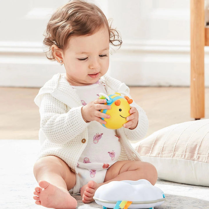 baby playing with  Skip Hop Crawl Toy Bee Cloud Lights Music Baby Crawling Development