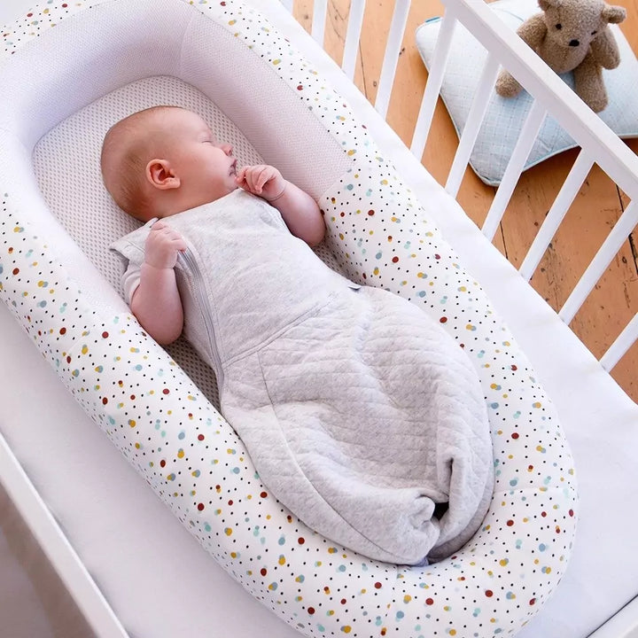 Baby sleeping comfortably in crib with the baby bed from Purflo