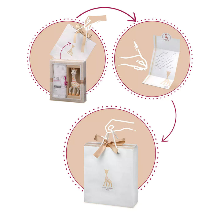 Close-up of a Sophie la Giraffe baby gift set. The image shows the natural rubber Sophie la Giraffe teething toy and the soft pink comforter with a white soother holder.