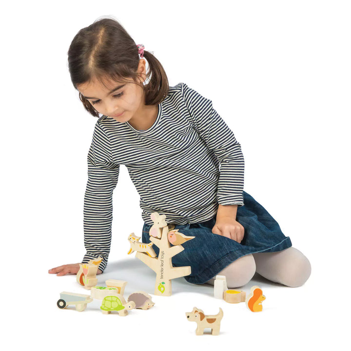 stacking garden friends wooden toy playing a girl