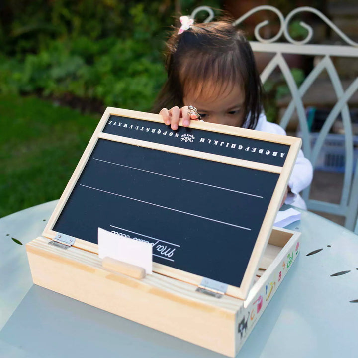 Child plating with chalk board