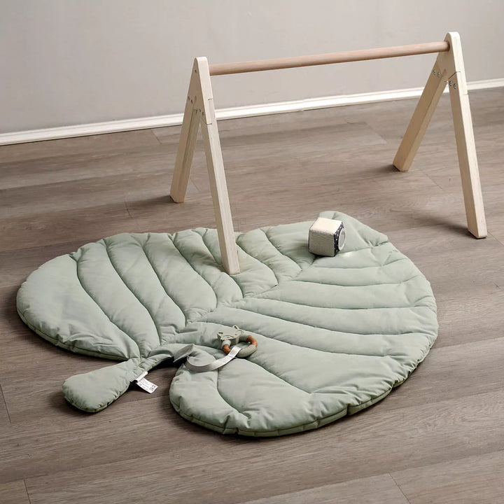 Leaf playmat comes with a durable silicone/wood teether with a ring, a baby-safe mirror and a soft sensory cube