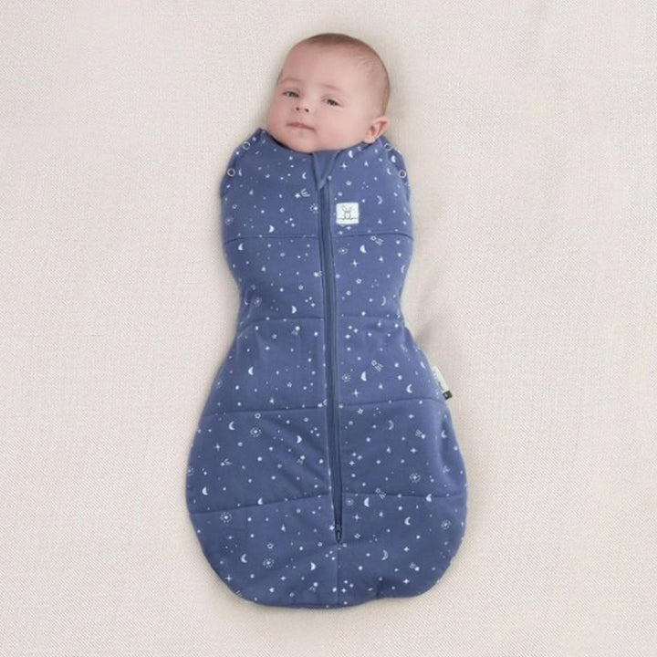 Baby wearing ergoPouch Cocoon Swaddle Bag 2.5 TOG Night Sky